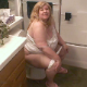 A fat, blonde woman sits on a toilet and speaks to you as if she is your mother. That makes it okay for you to watch her going pee pee and blowing stinkers on the potty. No audible pooping, but she does wipe her ass. About 5 minutes.